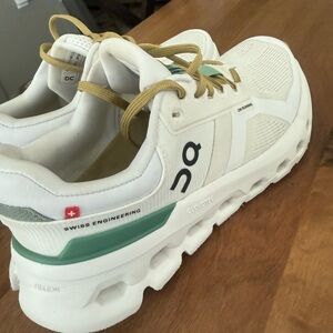 On Running White Shoes with Olive Laces